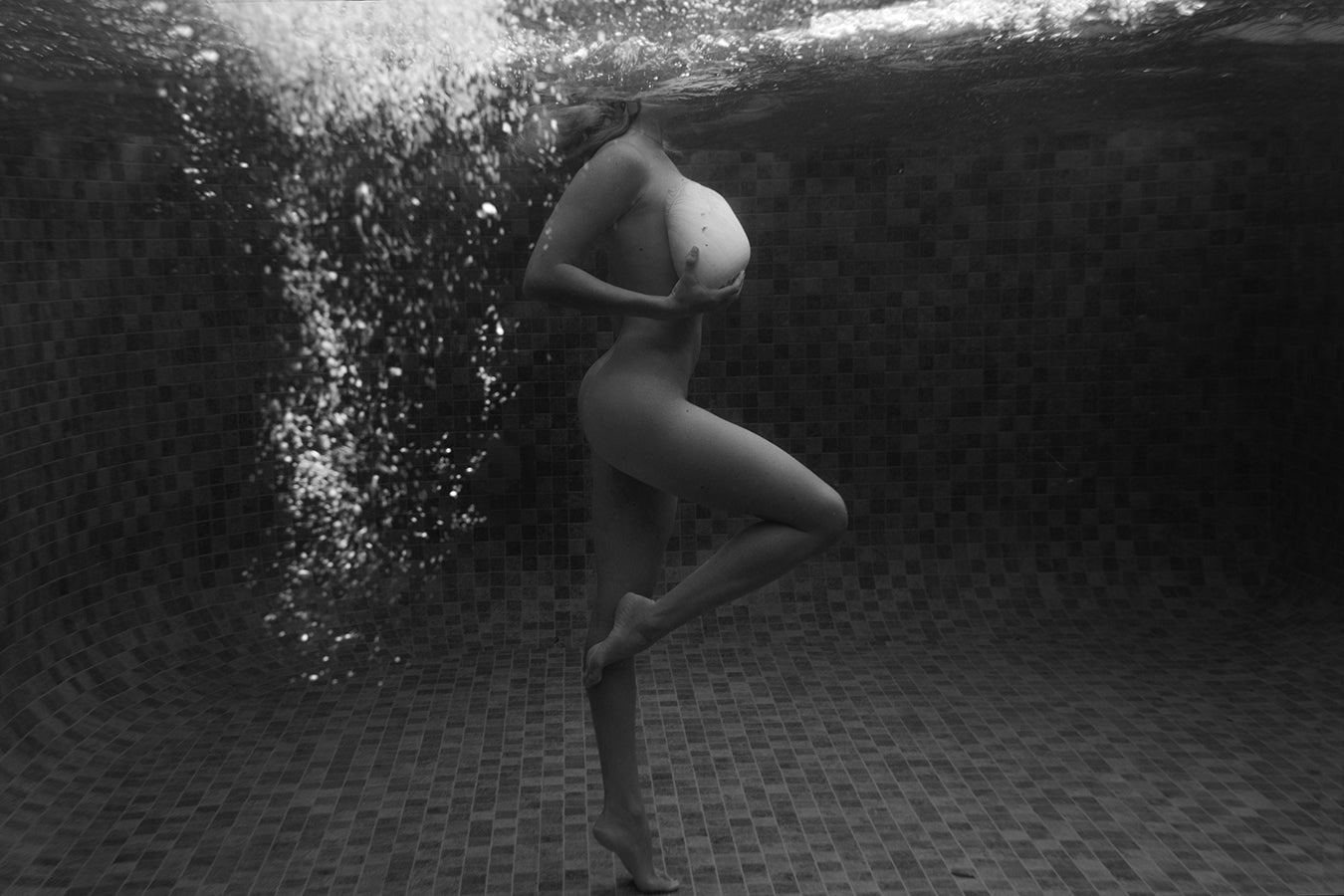 Shell & She #1 B&W by Francesca Owen captures a woman underwater in an ethereal style. Available as a fine art print, each piece includes a certificate of authenticity.