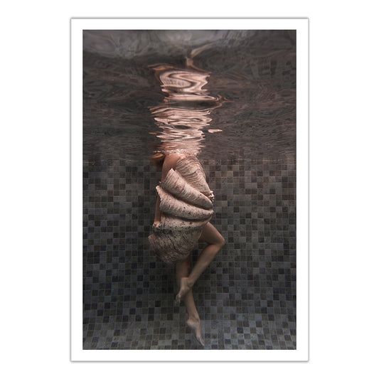 A person underwater, encased in a large seashell amid soft ripples and tiled pool walls, features in "Shell & She #3"—a fine art print by Francesca Owen that includes a certificate of authenticity.