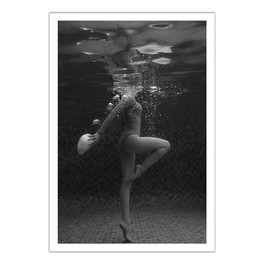 A swimmer stands underwater on one leg, holding a cap amid rising bubbles and pool tiles in the background. "Shell & She #4," a fine art print by Francesca Owen, comes with a certificate of authenticity.