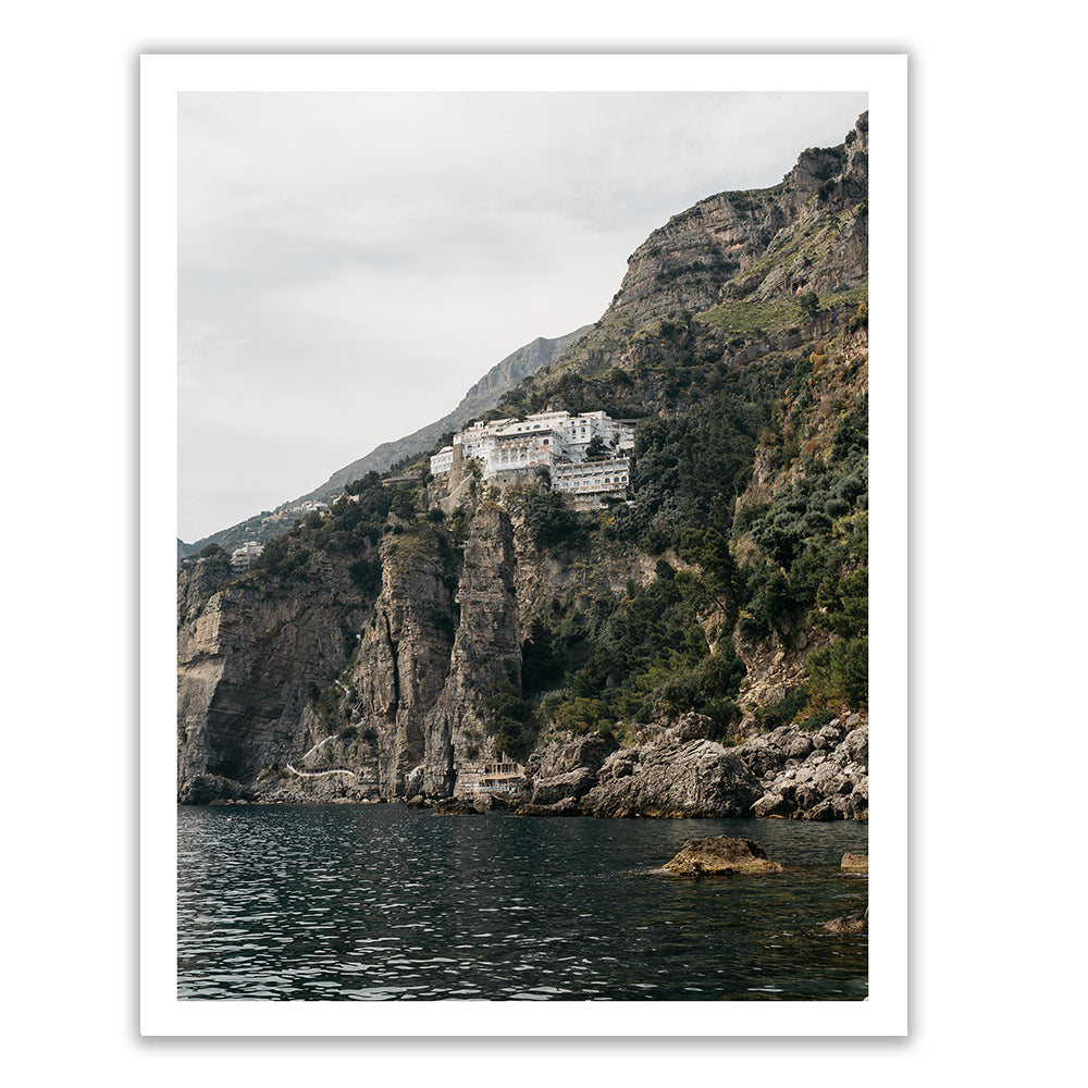 Introducing "Seaside in Praiano" by Francesca Owen: a meticulous capture of a building on a cliff, printed on fine art paper with archival pigments to evoke timeless beauty. Enjoy this stunning piece with our worldwide shipping service.