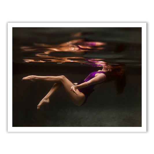 A woman in a purple swimsuit floats underwater in "Show Time Part 2, #2" by Francesca Owen—available as fine art prints with a certificate of authenticity.