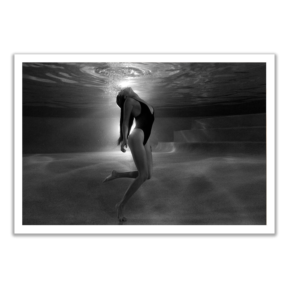 A woman arches her back underwater in "The Bower #4 B&W" by Francesca Owen, bubbles rising as light filters down. This ethereal scene is available as a fine art print with certificate of authenticity from Francesca Owen.