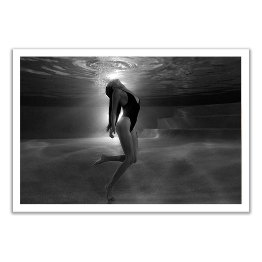 A woman arches her back underwater in "The Bower #4 B&W" by Francesca Owen, bubbles rising as light filters down. This ethereal scene is available as a fine art print with certificate of authenticity from Francesca Owen.
