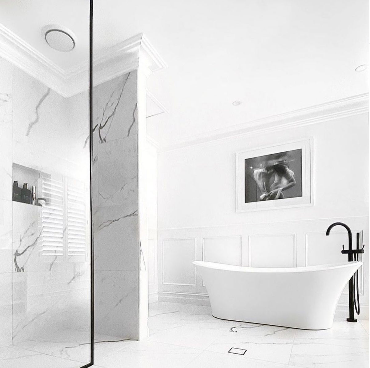 The intriguing black and white underwater photograph, titled "Softness #1 B&W" by Francesca Owen, captures a person partially submerged in water wearing an unbuttoned, translucent white shirt. With their head above the water's surface and their torso and hands below, the image creates an ethereal and serene atmosphere ideal for fine art prints or custom framing.
